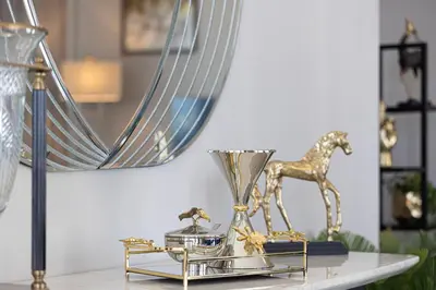 a table with a trophy and a mirror on it at Magnificent Cozy 2BR in Downtown Dubai in Dubai