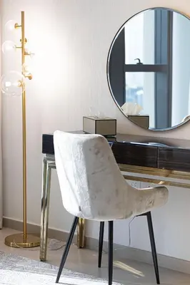 a desk with a white chair and a mirror at Magnificent Cozy 2BR in Downtown Dubai in Dubai
