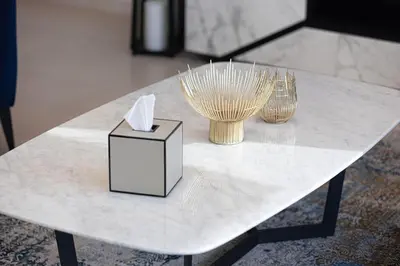 a white table with two vases and a box on it at Magnificent Cozy 2BR in Downtown Dubai in Dubai