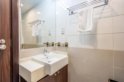 a bathroom with a sink and a mirror at GuestReady - Glamourous living in Palm Jumeirah in Dubai