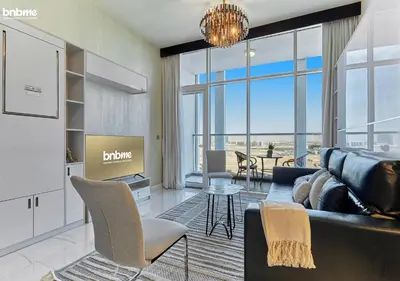 a living room with a couch and a table at bnbmehomes - Bayz by Danube in Dubai