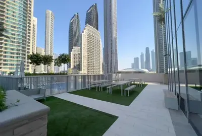 a balcony with benches and a view of a city at Modern 1 BR with Sea View - Minutes to Dubai Mall, Downtown Dubai in Dubai