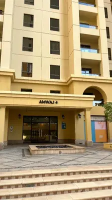 a large building with an amazon sign on it at AMWAJ JBR Walk Beachfront Apt in Dubai