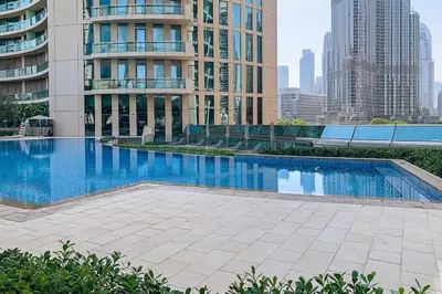 a large swimming pool in the middle of a building at Frank Porter - Burj Vista 1 in Dubai