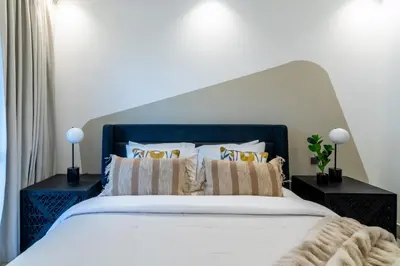 a bedroom with a large white bed with pillows at The Smart Concierge - Reehan 8 in Dubai
