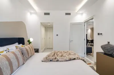 a bedroom with a bed with a blanket on it at The Smart Concierge - Reehan 8 in Dubai