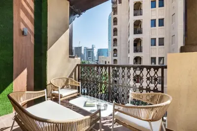 a balcony with chairs and a view of the city at The Smart Concierge - Reehan 8 in Dubai