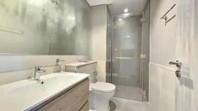 a bathroom with a toilet and a sink and a shower at Zada Tower , near to Burj Khalifa NYE fireworks in Dubai