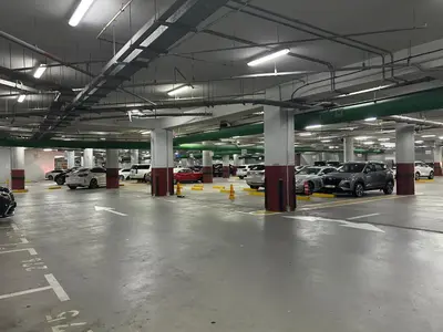 an empty parking garage with cars parked in it at JBR Beach Full Sea View 2 BR High Floor in Dubai