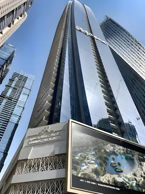 a tall building with a billboard in front of it at Wondrous 1BR at DAMAC Heights Dubai Marina by Deluxe Holiday Homes in Dubai