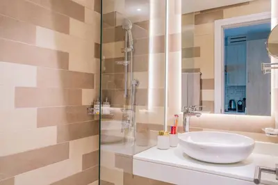 a bathroom with a sink and a shower at Studio with pool and private beach access on Palm Jumeirah in Dubai