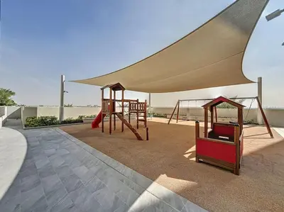 a large tent with swings and a playground at Summer at Creek Beach - Elegant One Bedroom in Dubai