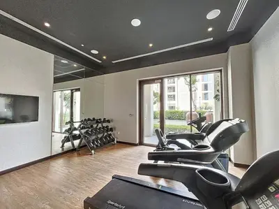 a gym with a bunch of exercise bikes in it at Summer at Creek Beach - Elegant One Bedroom in Dubai