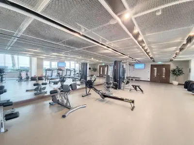 a gym with treadmills and exercise equipment in a building at Beach Isle - Gorgeous One Bedroom in Dubai