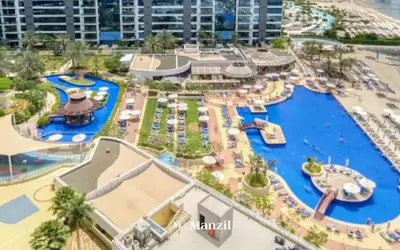 an aerial view of a water park at a resort at Manzil - 3BR in Palm Jumeirah with Private Beach Access & Sea View in Dubai