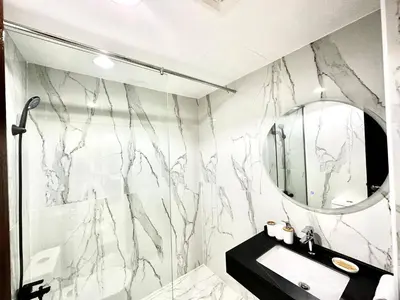 a bathroom with a sink and a mirror at Elegant 2 BR in Dubai Marina walking Metro & Beach- Marina Park in Dubai