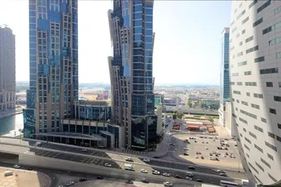 an aerial view of a busy city street with traffic at Studio Apartment in Merano Tower by The S Holiday Homes in Dubai