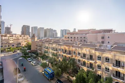 an overhead view of a city with buildings and a street at GuestReady - A beautiful home in Jumeirah Village in Dubai
