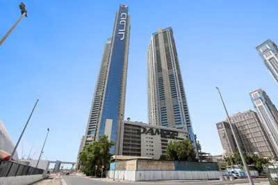 two tall buildings in the middle of a city at Silkhaus New Modern studio - Business Bay - O in Dubai
