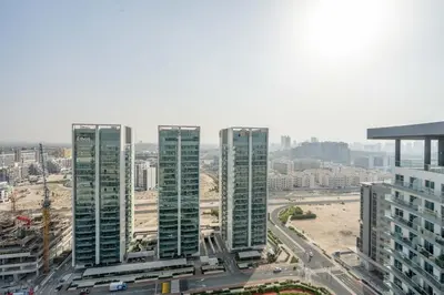 a group of tall buildings in a city at GuestReady - Bella Rose residence in Dubai in Dubai