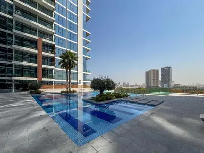 a swimming pool in the middle of a building at Frank Porter - Park Gate Residences 1 in Dubai