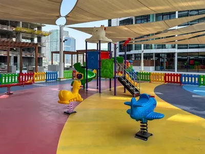 an empty playground in a building with a playground at Frank Porter - Park Gate Residences 1 in Dubai