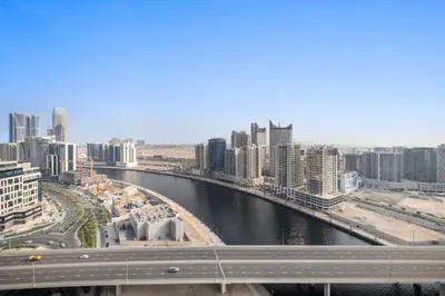 a view of a city with a river and buildings at ALiving Charming 1BR I Canal Views I DAMAC Maison Prive B- 2101 in Dubai