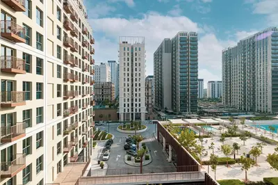 an aerial view of a city with tall buildings at Beautiful 1 Bedroom Dubai Hills with Pool View in Dubai