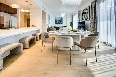 a dining room with a table and chairs at Sea View 3 BD apartment in La Mer near the beach in Dubai