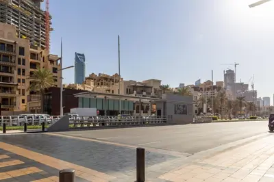 a street with a parking lot in a city at Frank Porter - Reva Residence in Dubai