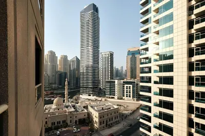 a view of a city with tall buildings at Marina View Manchester tower in Dubai