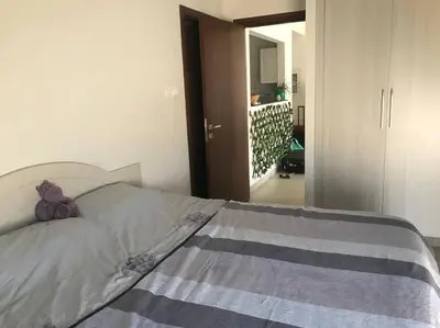 a bedroom with a bed with a stuffed animal on it at Burj Khalifa view/ Cozy apartment in Dubai
