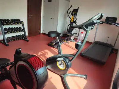 a room with a gym with a exercise bike at Burj Khalifa view/ Cozy apartment in Dubai