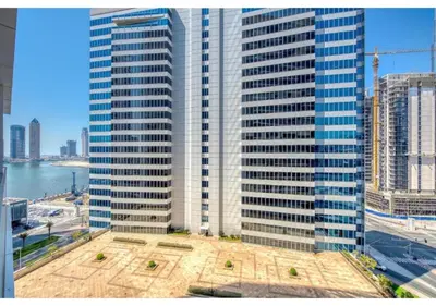 a view of a large city with tall buildings at Keyrock Living - Studio with Burj Khalifa View in Dubai