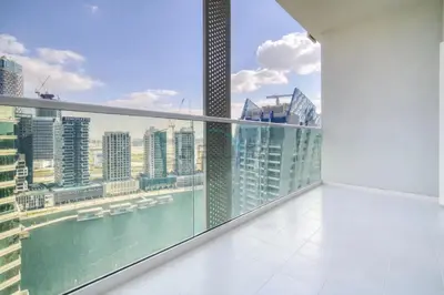 a balcony with a view of the city at Hot Offer Modern 1BR with Scenic Water Canal Views by Deluxe Holiday Homes in Dubai