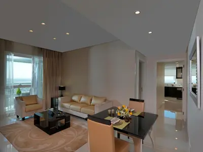a living room with a couch and a table at DAMAC Maison Canal Views in Dubai