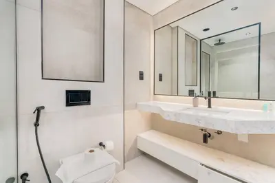 a bathroom with a sink and a toilet and a mirror at Unique Studio in JVC - Dubai in Dubai