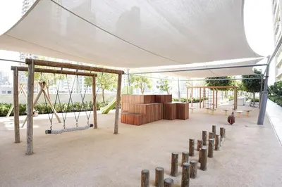 a pavilion with a playground with swings at Downtown Luxurious 1BR Near Dubai Mall and Fountain in Dubai
