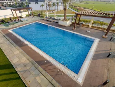 an overhead view of a swimming pool at a hotel at Elegant 2-BR Gem Quick Access Downtown Dubai in Dubai