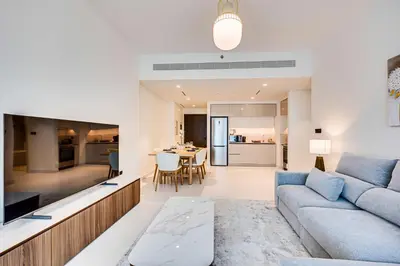 a living room with a couch and a table at Marina Vista 1BD with beach access in Beachfront in Dubai