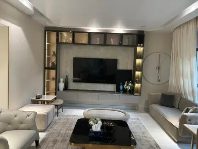 a living room with a couch and a tv at USMANS 4BDRM APARTMENT SEA VIEW Direct BEACH Access Fully Serviced JBR in Dubai