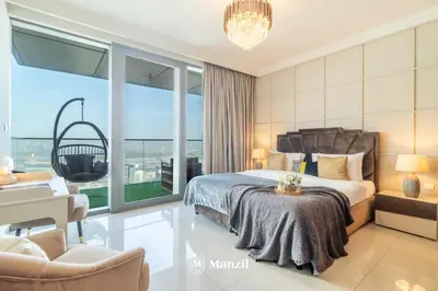 a bedroom with a bed and a large window at Manzil - 3BR in Boulevard Point connected to Dubai Mall with Incredible View of Burj Khalifa in Dubai