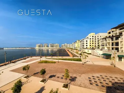 a view of a city with buildings and the water at La Voile by Merass, La Mer Dubai in Dubai