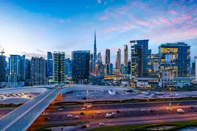 a city skyline with a highway in front of buildings at FAM Living - Upside Living - WFH Friendly-Business Bay in Dubai