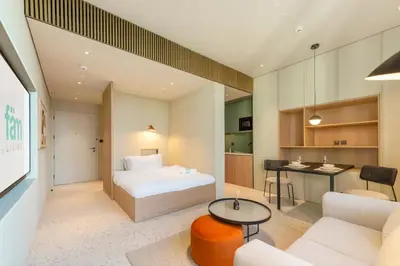 a hotel room with a bed and a table at FAM Living - Upside Living - WFH Friendly-Business Bay in Dubai
