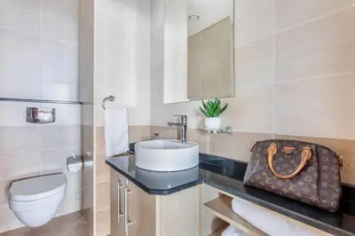 a bathroom with a sink and a toilet at Frank Porter - Ocean Heights in Dubai