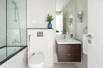 a bathroom with a toilet and a sink and a shower at Frank Porter - Avanti Tower in Dubai