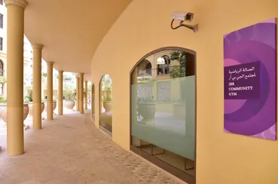 a hallway of a building with a sign on the wall at GuestReady - Beachside Escape near Marina Beach in Dubai