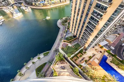 an aerial view of a city with buildings and the water at Stunning 1BD Marina view apartment in Dubai Marina in Dubai