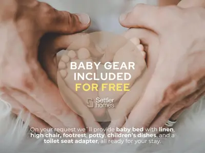 a picture of two hands holding a baby heart at SettlerHomes - 2BR Downtown Haven, Ideal For Family Comfort in Dubai